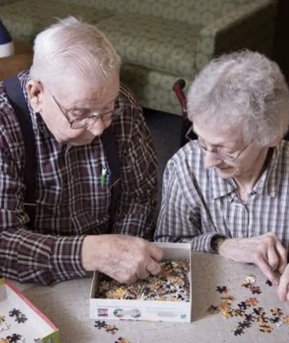 Senior couple doing a puzzle together
